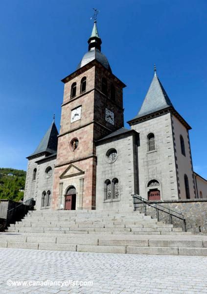 Riders drop down the steps in front of the church