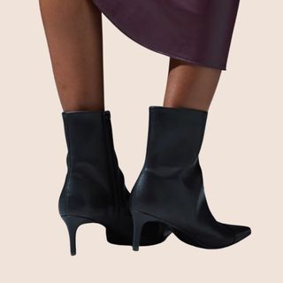 flat lay image of black ankle boots