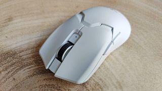 Razer Viper V2 Pro review: white mouse on wooden table