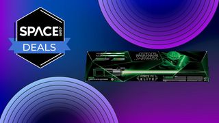 A black and green box featuring a green lightsaber and Yoda on the front infront of some purple disco circles and a black space.com logo