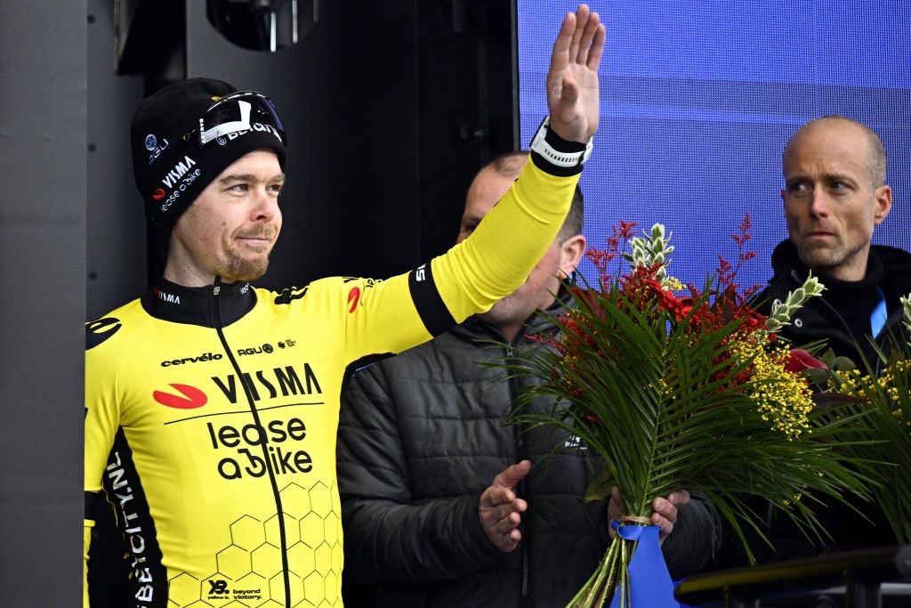 Slovenian Jan Tratnik of Team Visma-Lease a Bike celebrates on the podium after winning the 79th edition of the men's one-day cycling race Omloop Het Nieuwsblad (UCI World Tour), 202km from Gent to Ninove on February 24, 2024. (Photo by JASPER JACOBS / Belga / AFP) / Belgium OUT