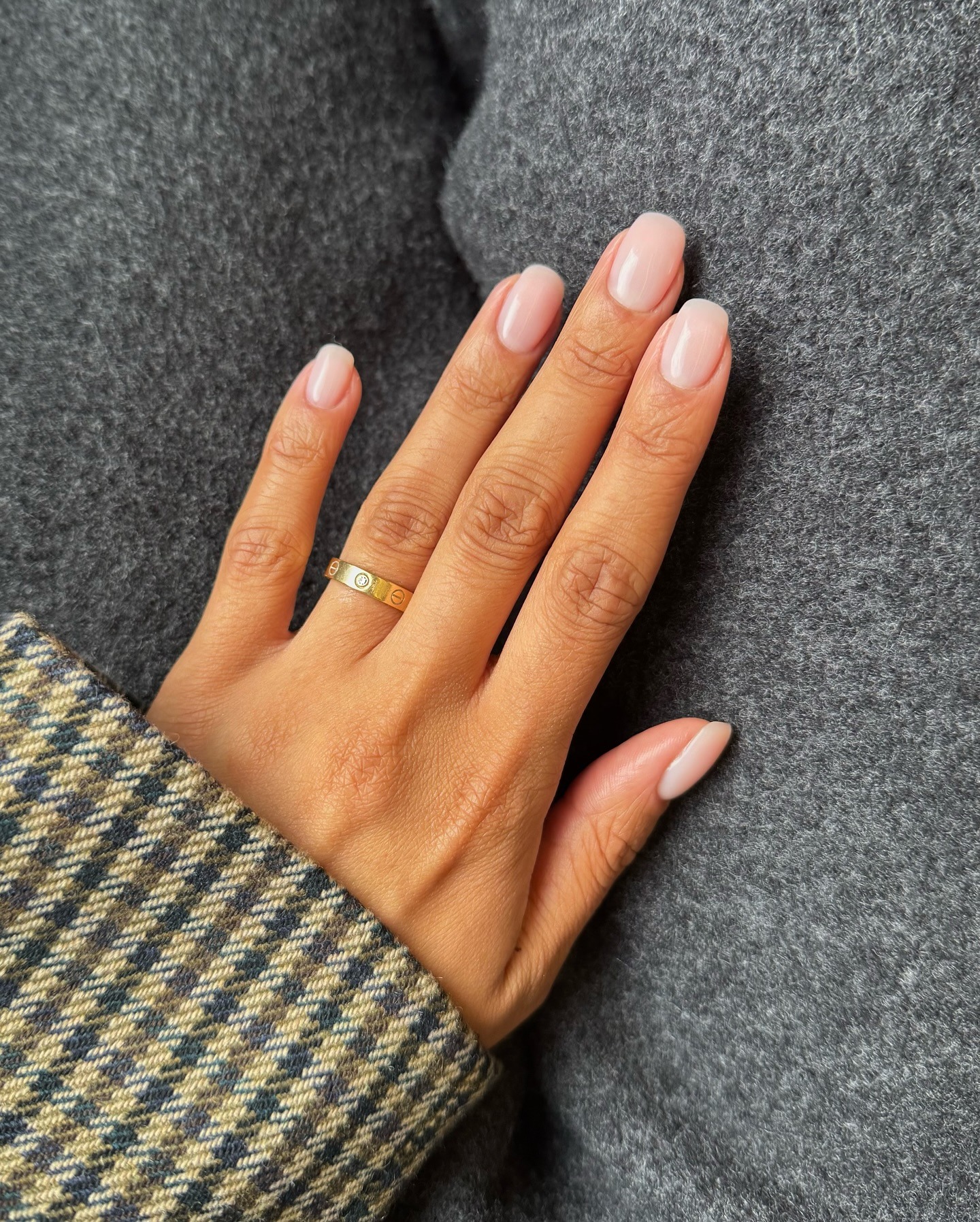 Squoval, sheer pink nails.