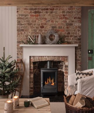 Cream fireplace with exposed brick wall