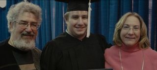 a family photo of Seth Rich at his graduation with Mary Rich