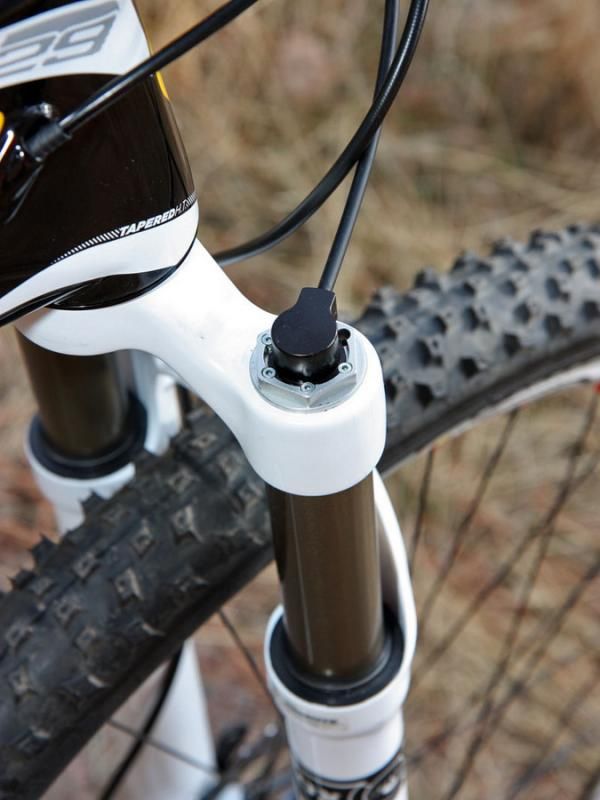 The remote lockout plunger head can be rotated as needed to get the smoothest cable routing. We ultimately decided to forego the stock behind-the-crown routing for a more direct path.
