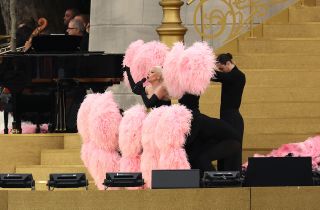 Lady Gaga in a pink and black feathered ensemble at the 2024 Olympics Opening Ceremony rehearsals in Paris July 2024