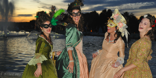 4 Women dressed in period costume in Versailles as the the sunrises.