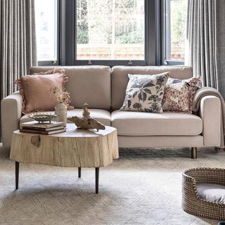 A beige sofa in a neutral living room
