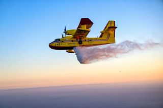  A Canadair CL-415 Super Scooper makes a water drop during a demonstration Wednesday, October 26, 2022. 