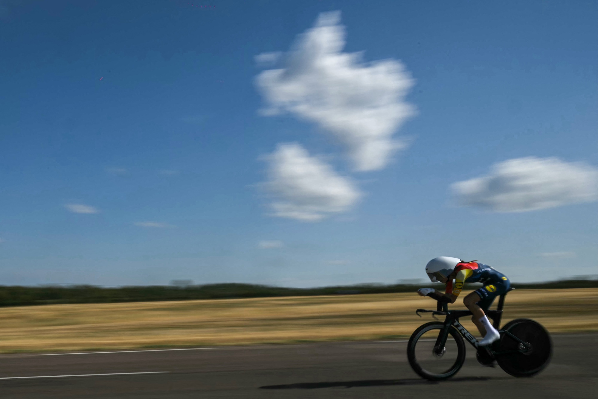 Lidl-Trek's Canadian rider Isabella Holmgren competes during the individual time-trial in the 4th (out of 9) stage of the fifth edition of the Women's Tour de France cycling race, 21 km time trial between Gevrey-Chambertin and Dijon, eastern France on August 4, 2026. (Photo by NICOLAS TUCAT / AFP)