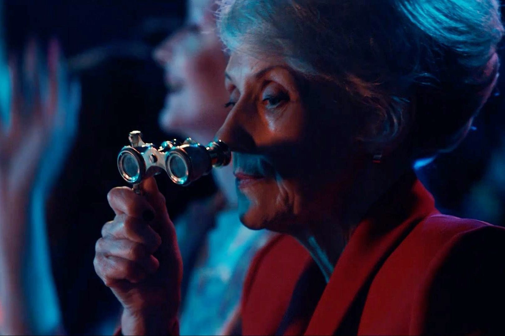 Mrs Flood in Doctor Who looking through binoculars