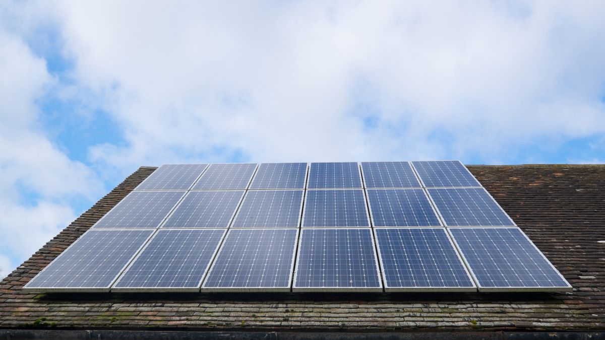 Roof of house with rows of solar PV panels