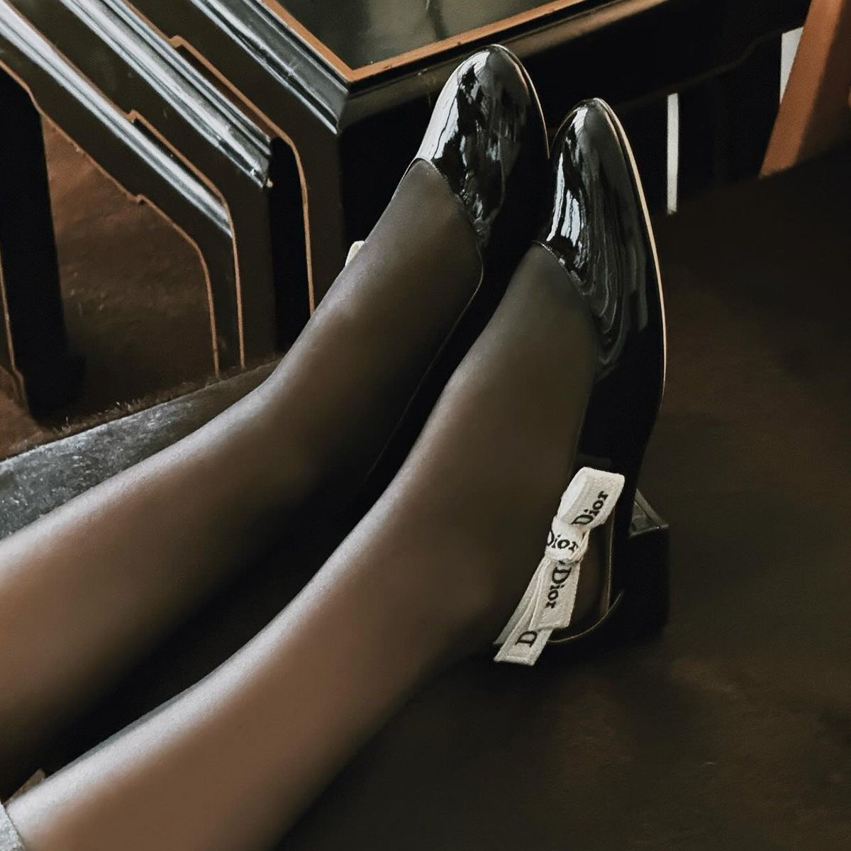 Photos of Aimee Song and Christie Tyler wearing the new Jonathan Anderson for Dior J'Adior patent leather ballet flats from the spring/summer 2026 collection.