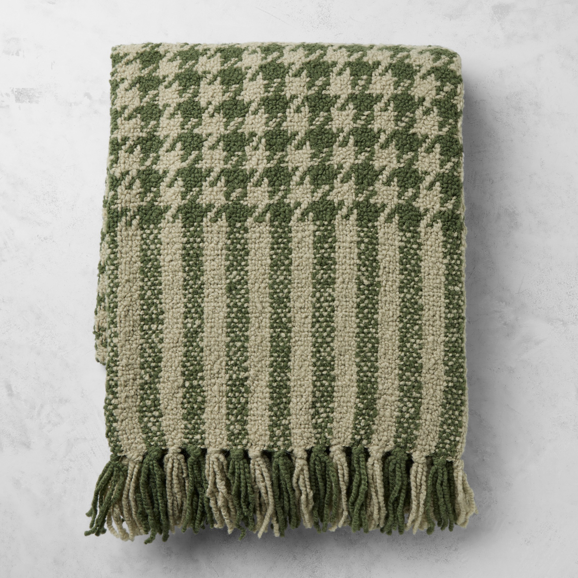 a green houndstooth throw blanket