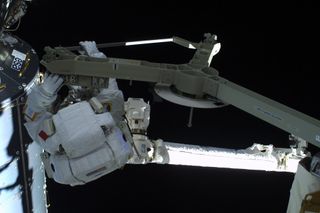 Parmitano on Canadarm, on Way to Port Side