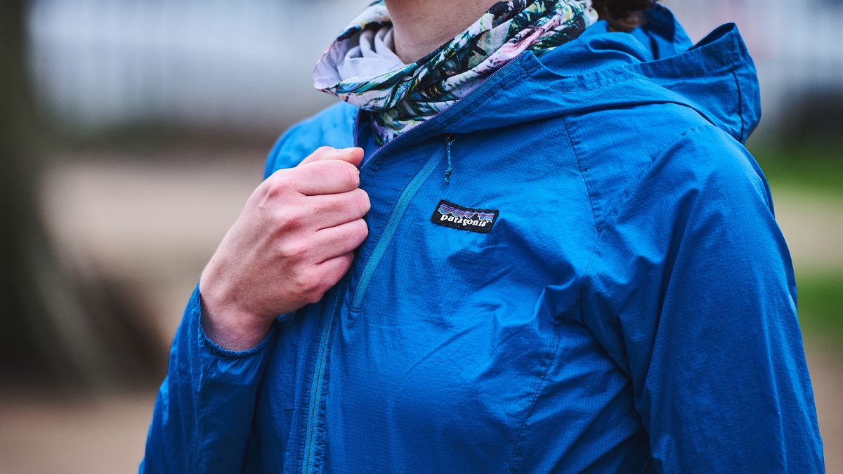 Woman fastening Patagonia Houdini jacket