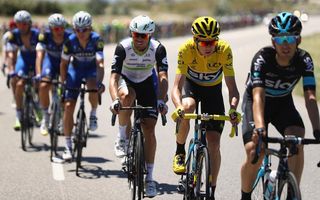 Mark Cavendish (Dimension Data) sits behind yellow jersey Chris Froome (Team Sky)