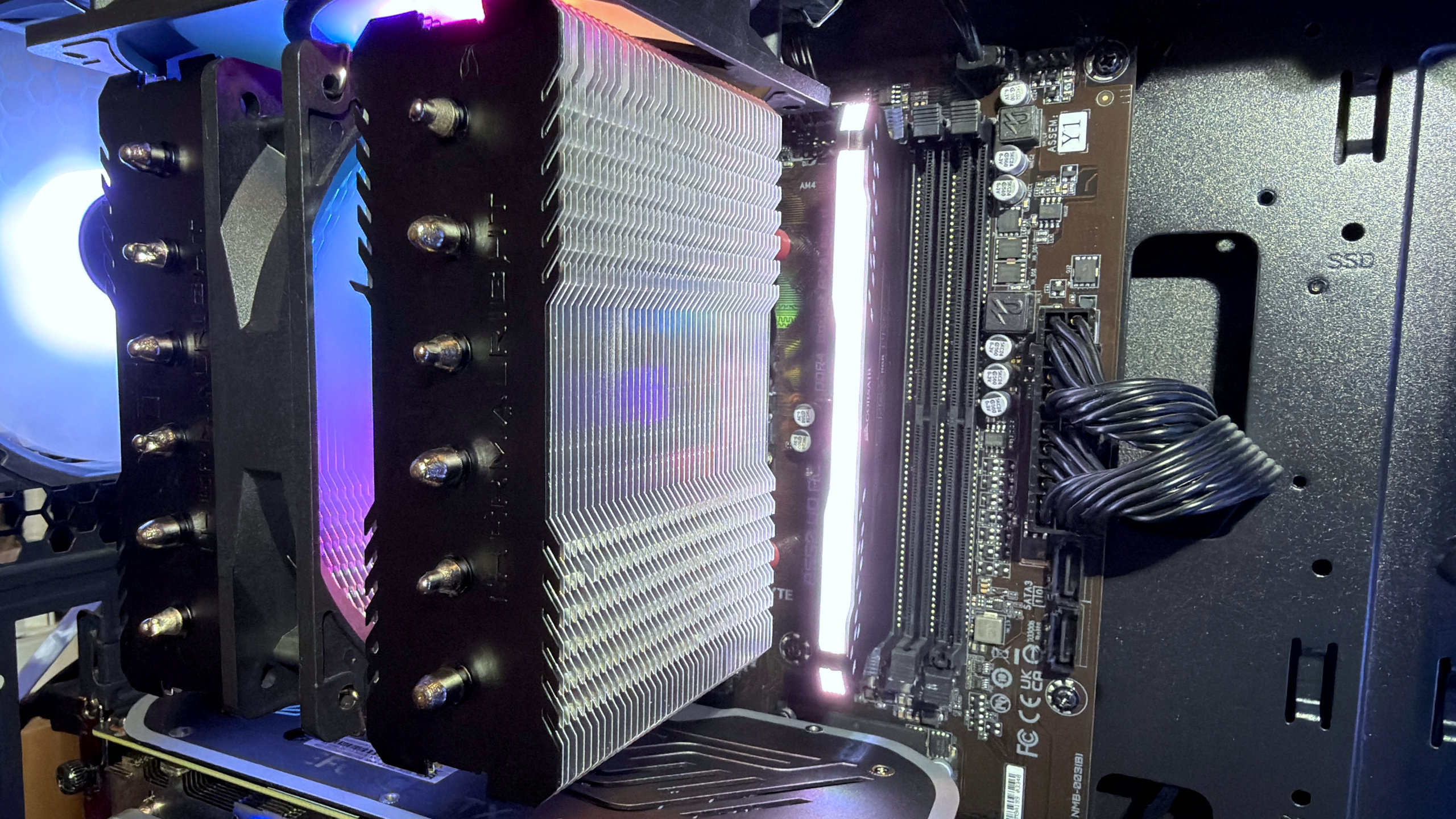 A close-up photo of a single DDR4 DIMM installed in a gaming PC's motherboard