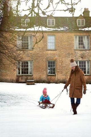 Cotswold house Christmas in snow
