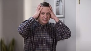 Tim Robinson holding his head in I think You Should Leave