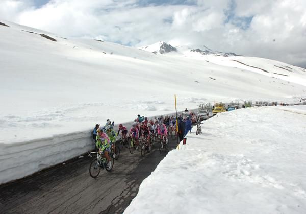 The maglia rosa group ascends on a cold and snowy stage 20.