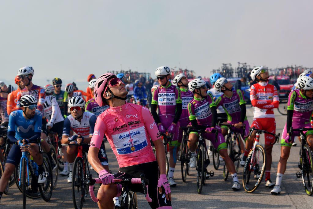 PIANCAVALLO ITALY OCTOBER 18 Start Joao Almeida of Portugal and Team Deceuninck QuickStep Pink Leader Jersey Frecce Tricolori Air Patrol Aerial exhibition Base Aerea Rivolto Team Presentation Peloton during the 103rd Giro dItalia 2020 Stage 15 a 185km stage from Base Aerea Rivolto Frecce Tricolori to Piancavallo 1290m girodiitalia Giro on October 18 2020 in Piancavallo Italy Photo by Stuart FranklinGetty Images