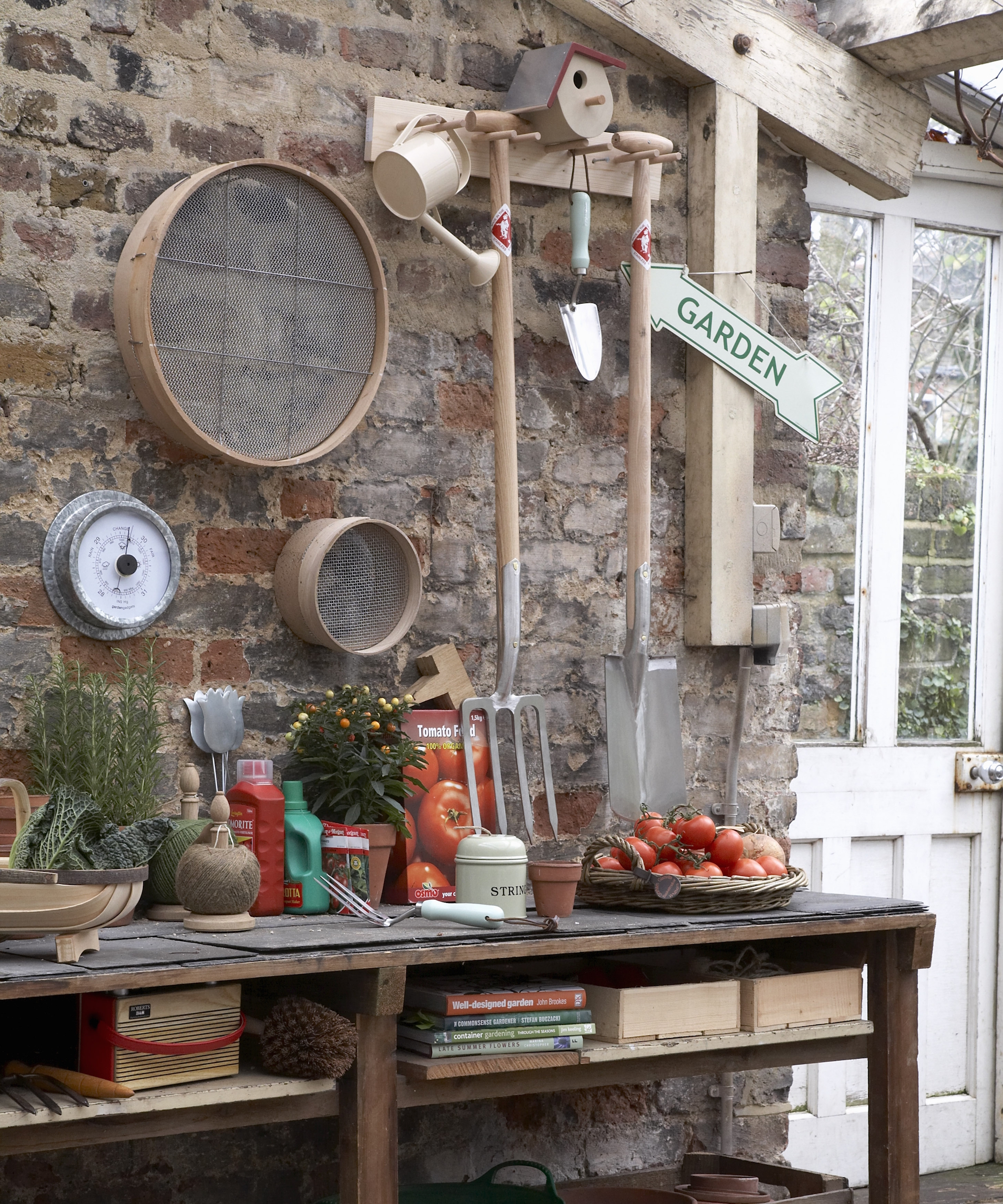 A bench with shelves in a garden shed as a work space