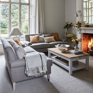grey wall with sofa and fire place