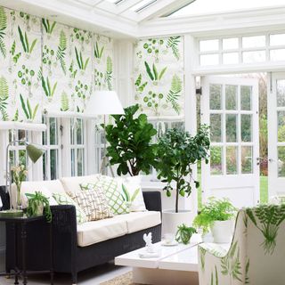 Green conservatory with sofa