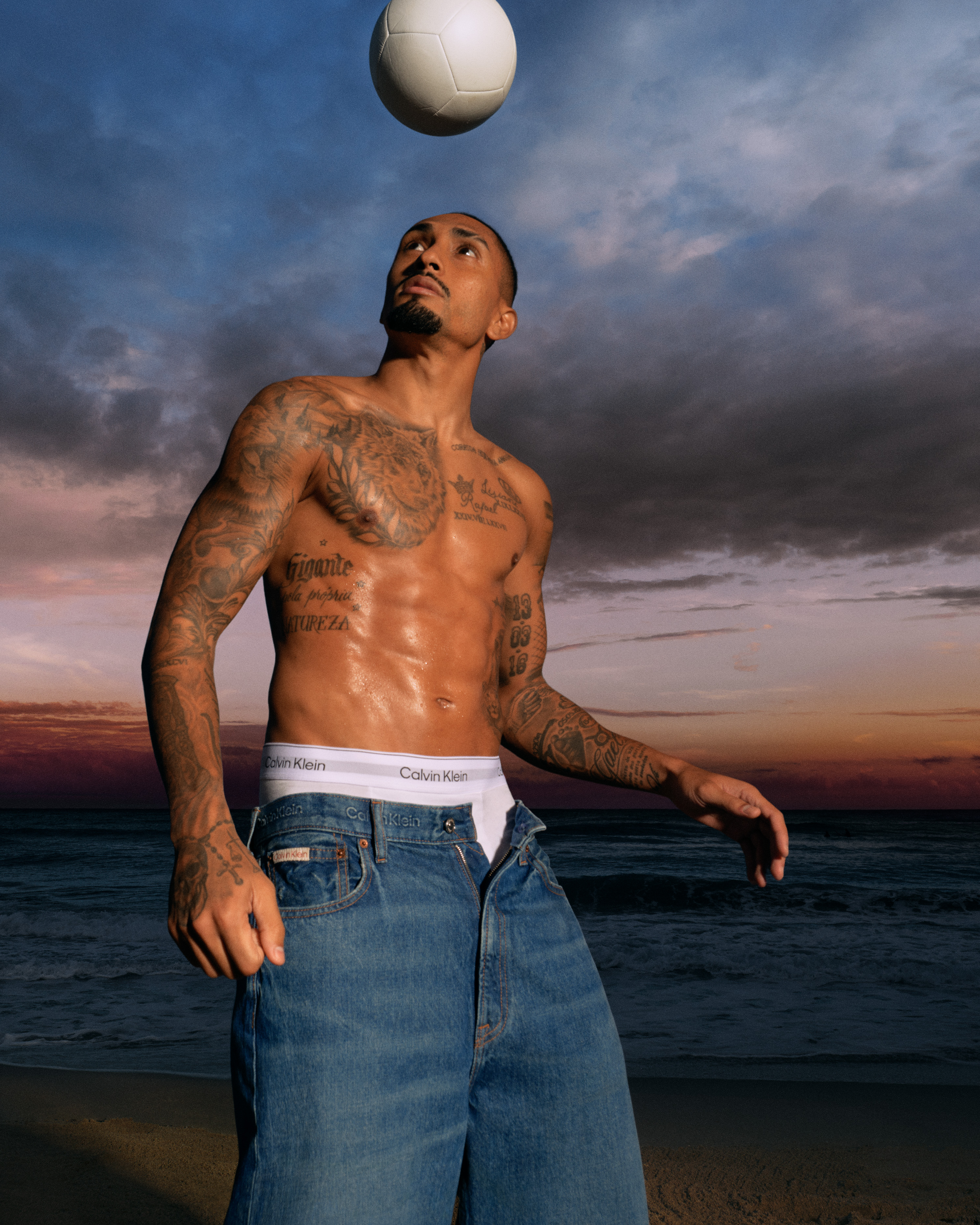 Brazilian footballer Raphinha stars in Calvin Klein's new underwear campaign wearing logo boxer briefs and jeans.