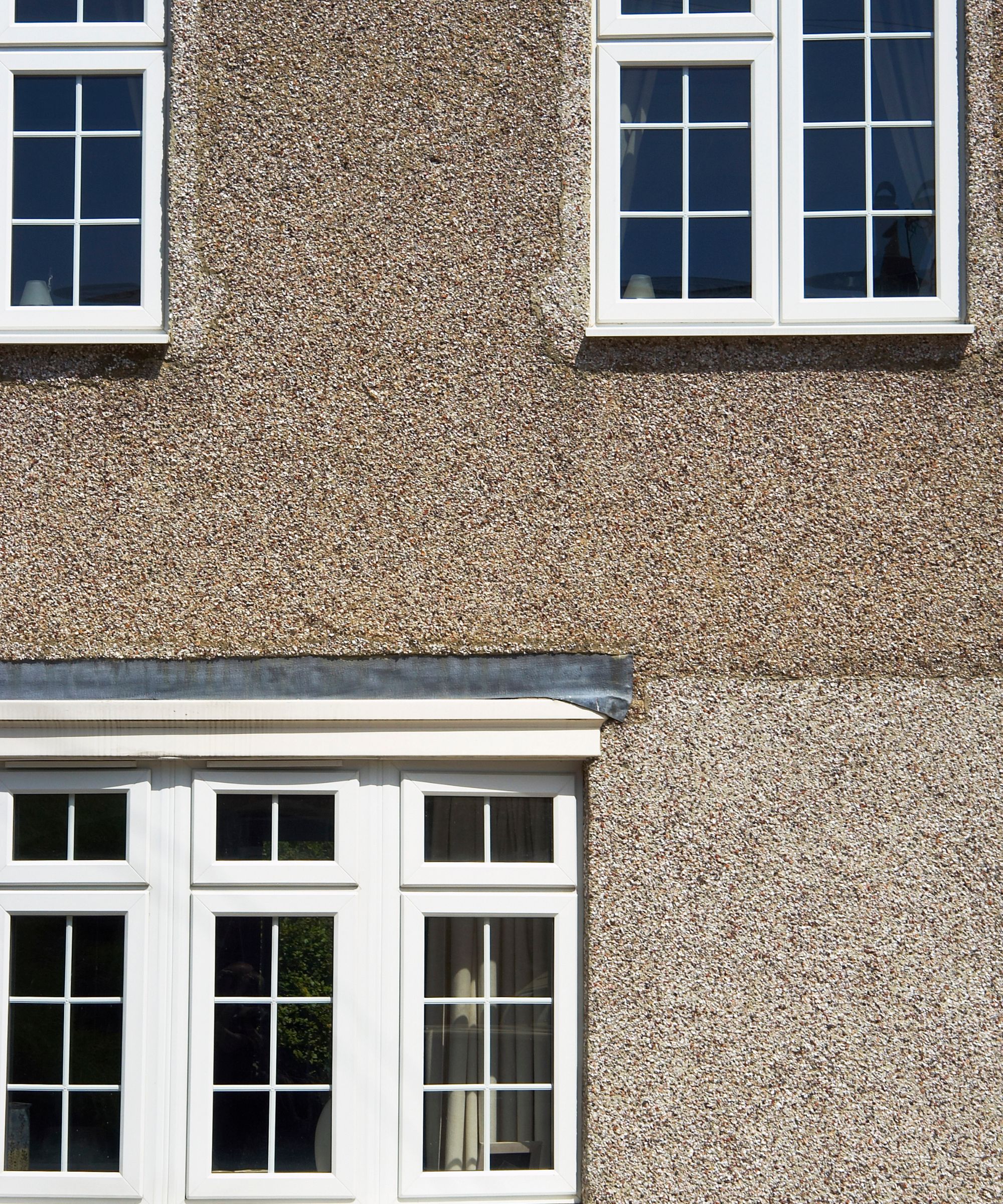 Pebble dash facade of a suburban house