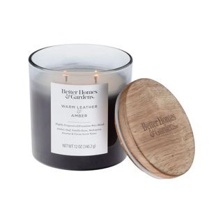 Better Homes & Gardens Warm Leather & Amber Candle against a white background.