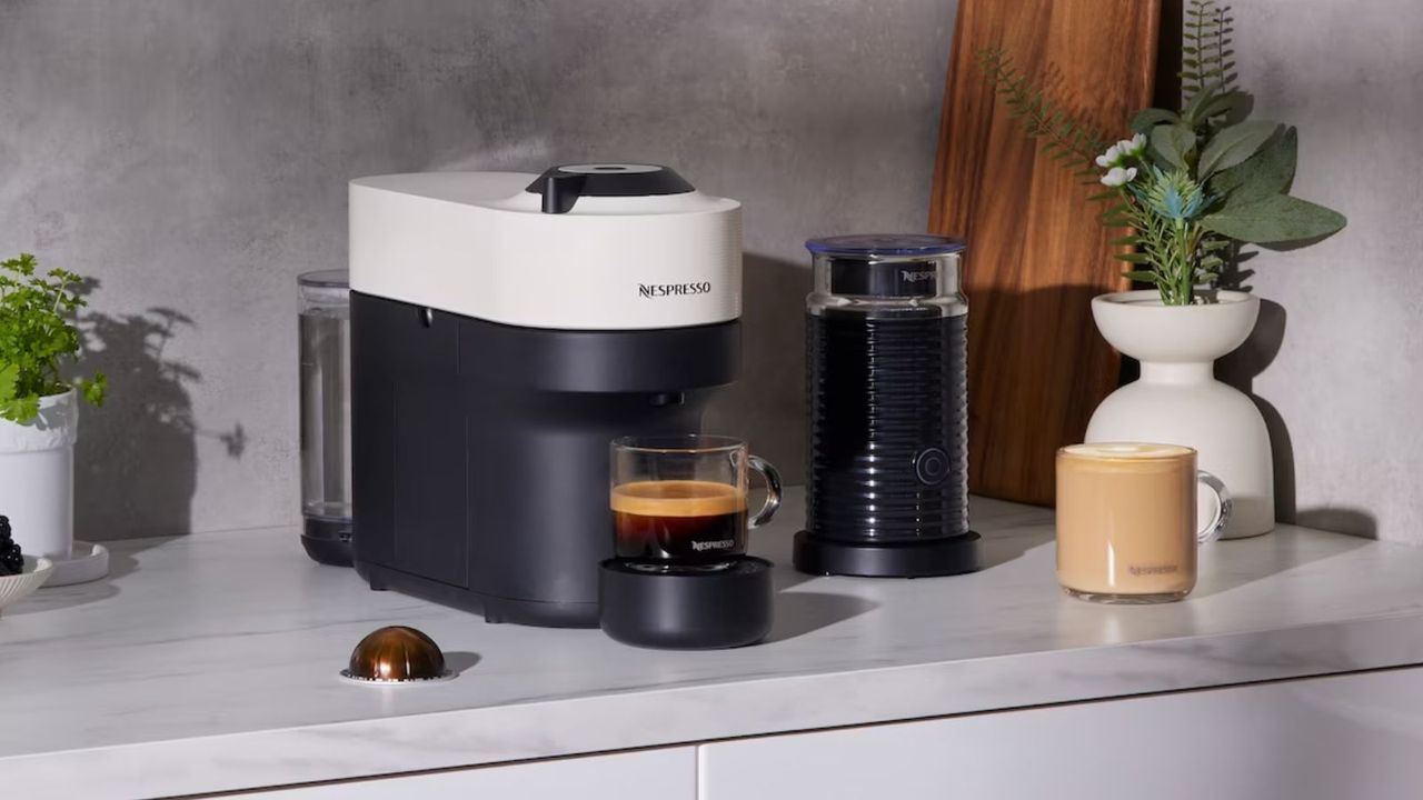 One of the best Nespresso deals, Nespresso Vertuo Pop in white on a grey countertop making coffee