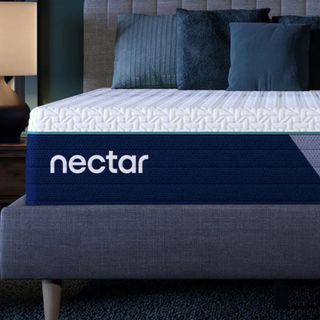 Blue pillows on the Nectar Premier Hybrid Mattress on a bed.