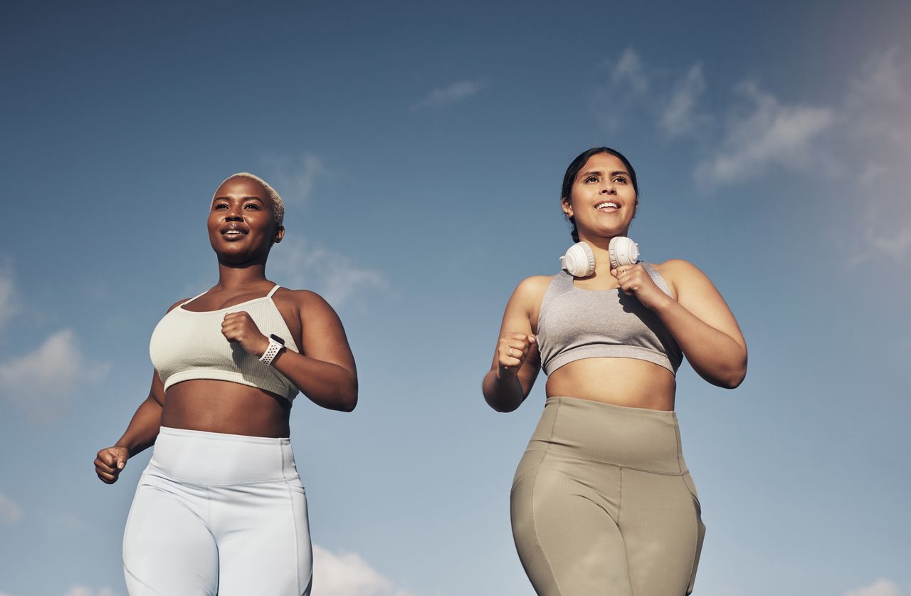 How long should a workout be? Shot of two young women out for a run together