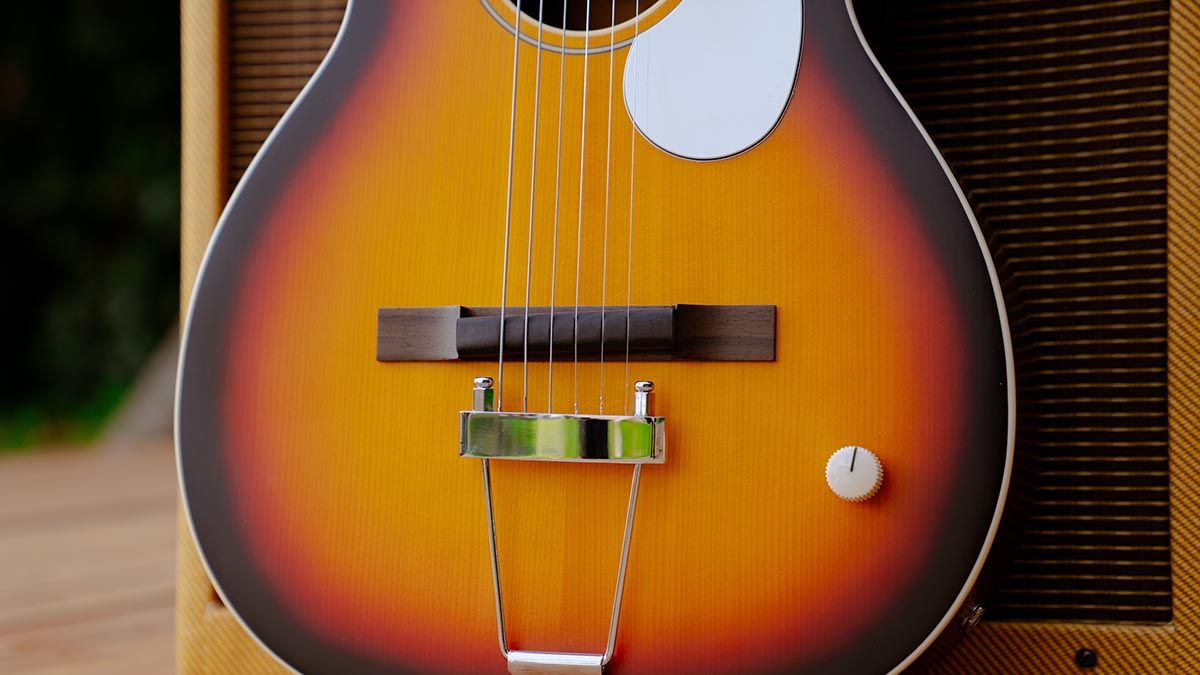 Orangewood Juniper, a parlour-sized acoustic fitted with a rubber bridge and a rail humbucker