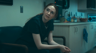 Karen Gillan sitting in a hospital in The Life Of Chuck