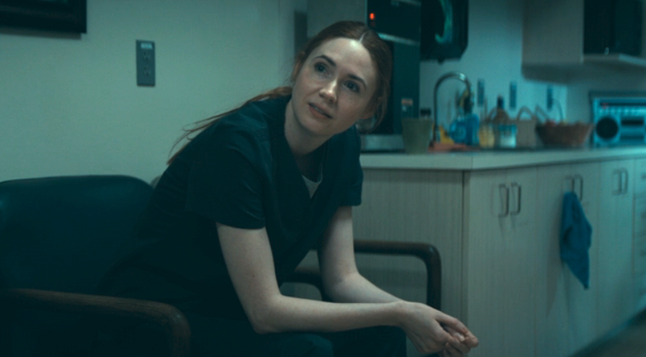 Karen Gillan sitting in a hospital in The Life Of Chuck