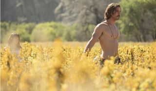 Bad TIme At The El Royale Chris Hemsworth wandering shirtless through a field