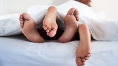 how to have good sex, couple's feet poking out from under sheets