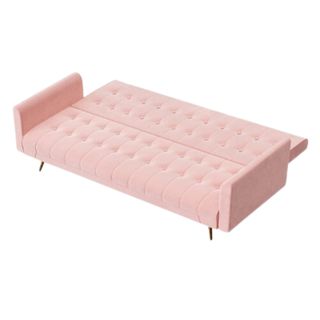 A pink velvet sofa bed folded out into a bed, with a white background.