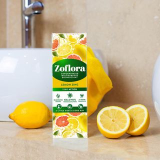 zoflora disinfectant with lemon yellow towel and white basin