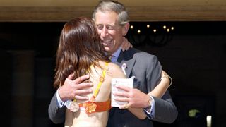 Prince Charles Receiving A Warm Hug When He Welcomed Walkers Into Highgrove In Honour Of The Funds Raised For The Charities Breakthrough Breast Cancer And The Bristol Cancer Help Centre. The Funds Were Raised At This Years Playtex Moonwalk - An Annual Power-walking Midnight Marathon Held In London. Nina Barough, Founder And Herself A Breast Cancer Survivor, Is Hugging Prince Charles.