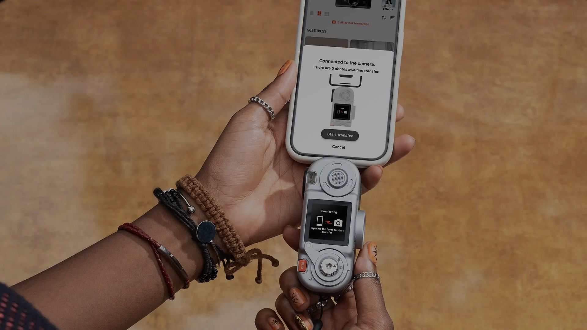 Fujifilm Instax Pal 2 compact camera connected to a phone for image uploads