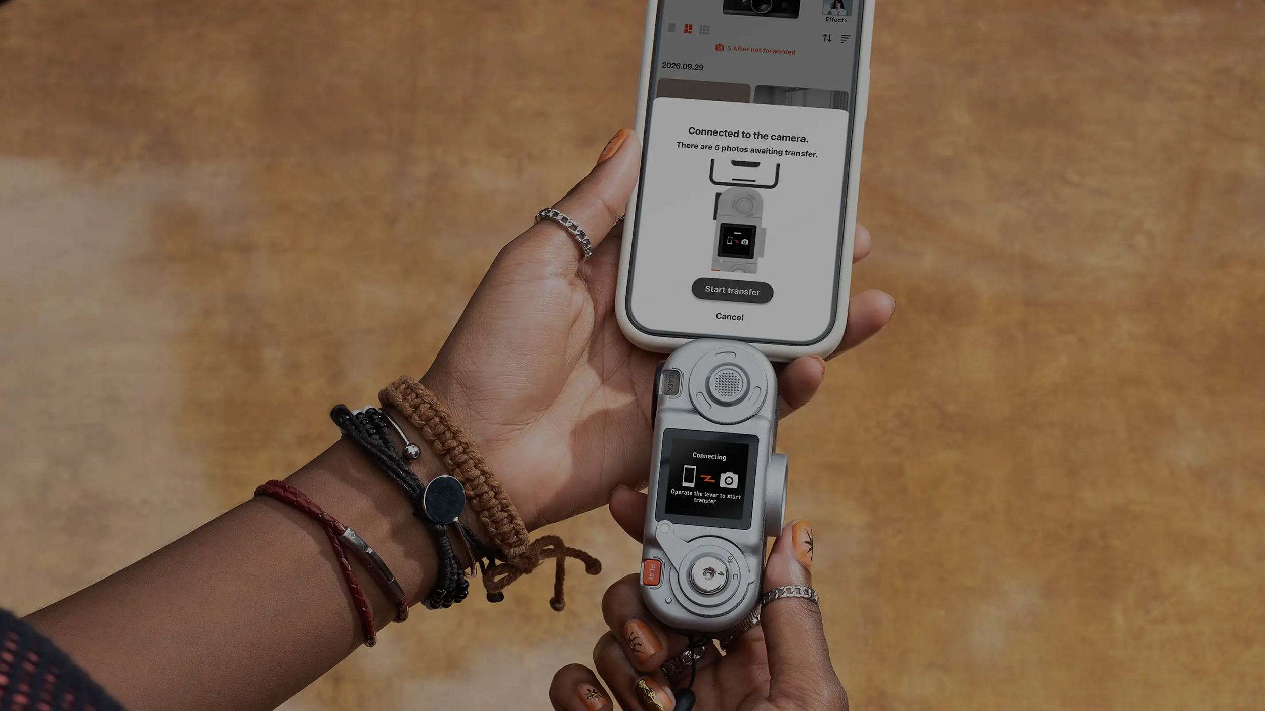 Fujifilm Instax Pal 2 compact camera connected to a phone for image uploads