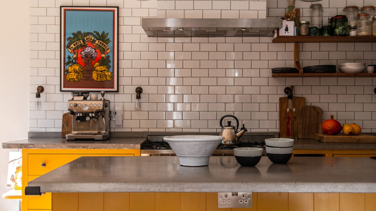 Yellow kitchen with subway tiles