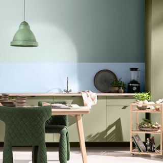 Pastel blue walls, with light pink table and counter tops