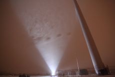 Snowflakes Falling Behind Wind Turbine
