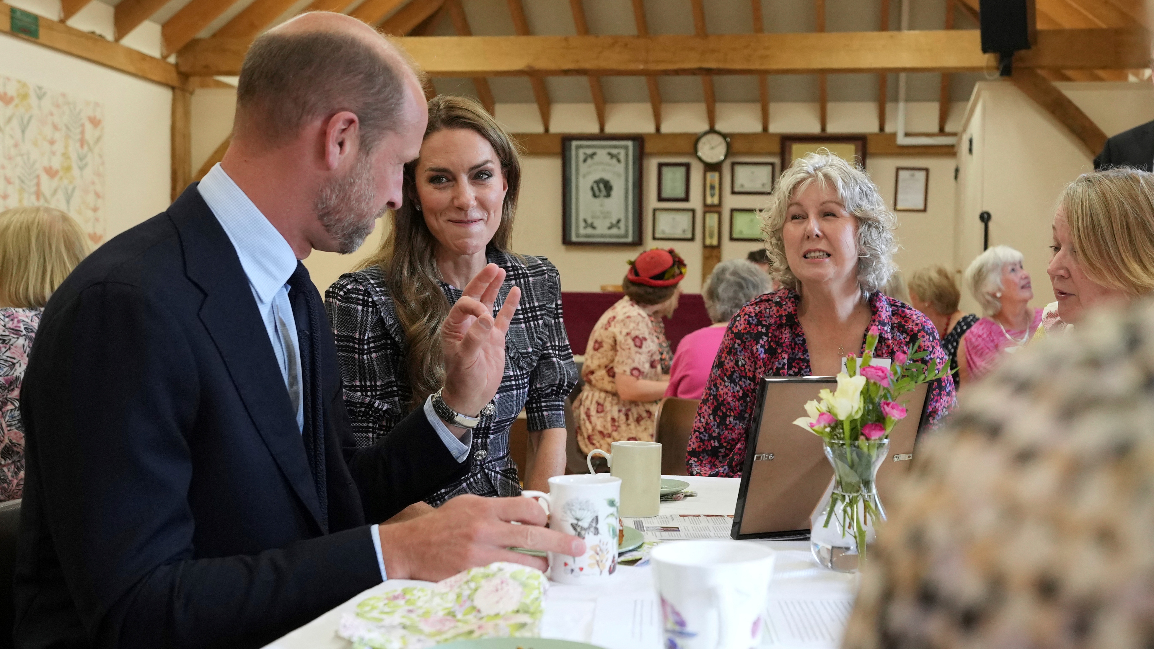 Catherine, Princess of Wales and Prince William, speak with members during a visit to the National Federation of Women's Institute (WI) in Sunningdale on September 8, 2025