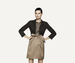 Model with black blazer, shirt and skirt